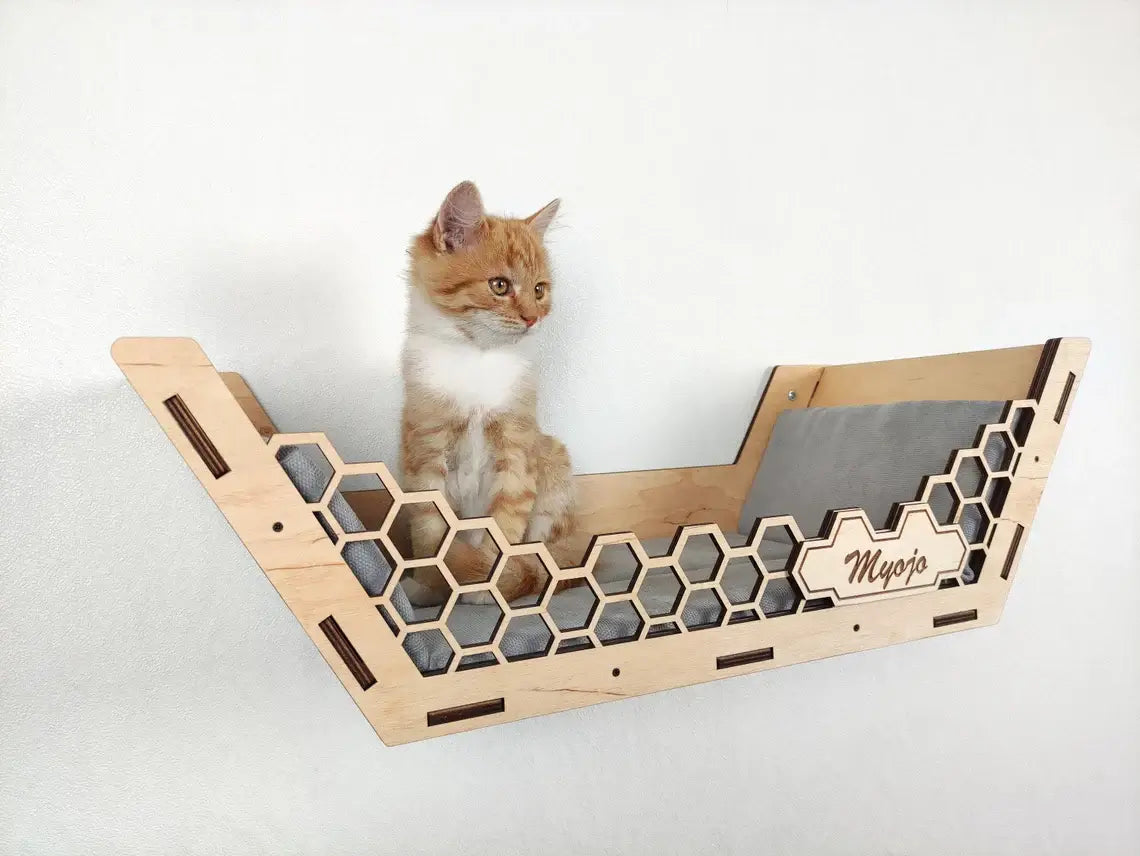 Beige Cat Wall Shelves Set assembly with floating shelves and steps. Easy installation for a cat shelving system that enhances your cat’s play area.