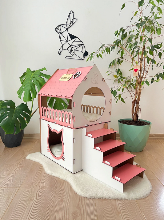 Side view of a white and pink medium two-story modern wooden cat house, highlighting the sleek design and spacious interior.